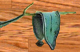 Dali melting clock hanging on a branch (detail)